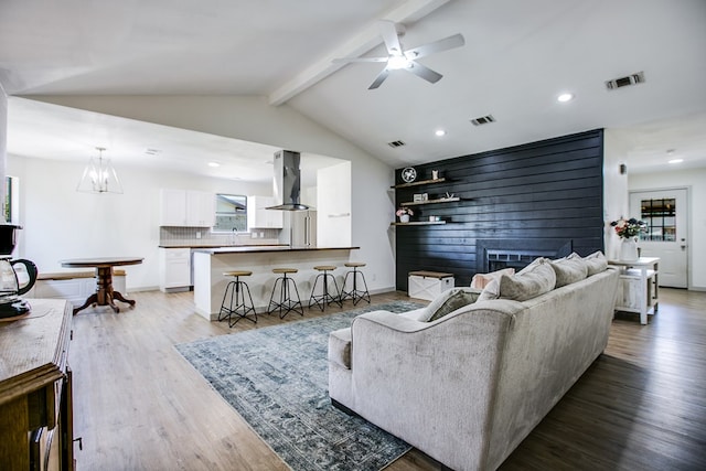 1106 Gregory Dr, San Angelo, TX 76905 - living room with wood finished floors, ceiling fan, recessed lighting, and a chandelier