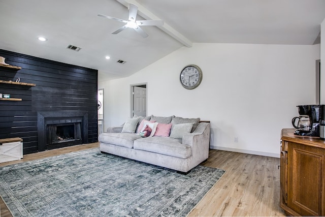 1106 Gregory Dr, San Angelo, TX 76905 - living area with light wood-style floors, a ceiling fan, a fireplace, and recessed lighting