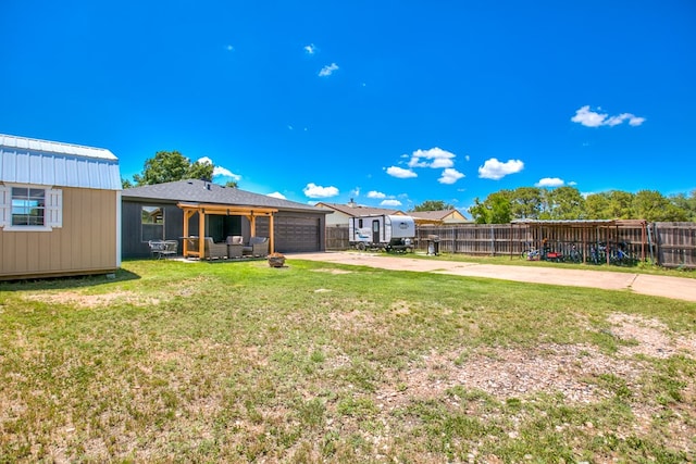 1106 Gregory Dr, San Angelo, TX 76905 - view of yard featuring driveway and a garage