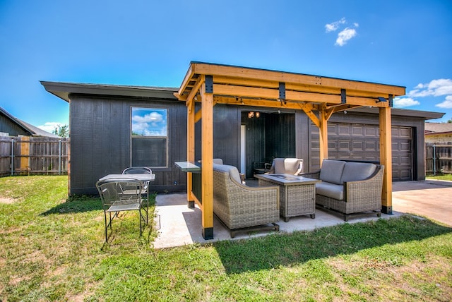 1106 Gregory Dr, San Angelo, TX 76905 - rear view of property with a patio, an outdoor hangout area, and a garage