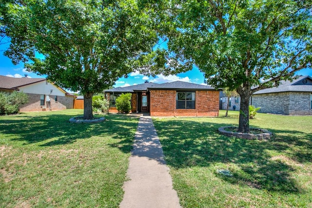 1106 Gregory Dr, San Angelo, TX 76905 - ranch-style house with a front yard and brick siding