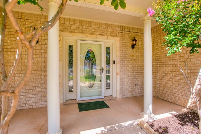 601 Burlington Rd, San Angelo, TX 76901 - view of exterior entry featuring brick siding and a porch