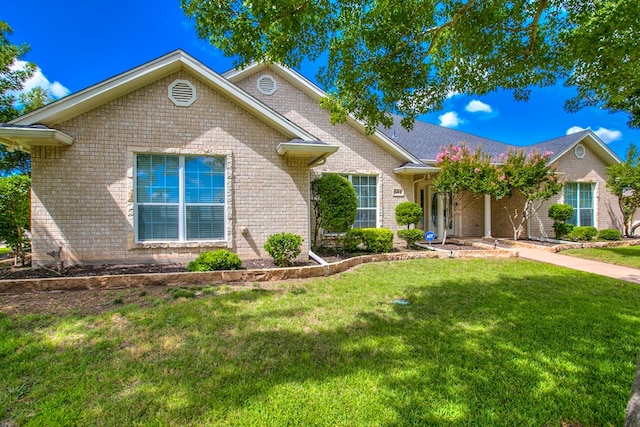 601 Burlington Rd, San Angelo, TX 76901 - view of front of home with brick siding and a front yard
