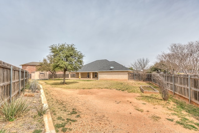 601 Burlington Rd, San Angelo, TX 76901 - fenced backyard featuring a shed and a garden