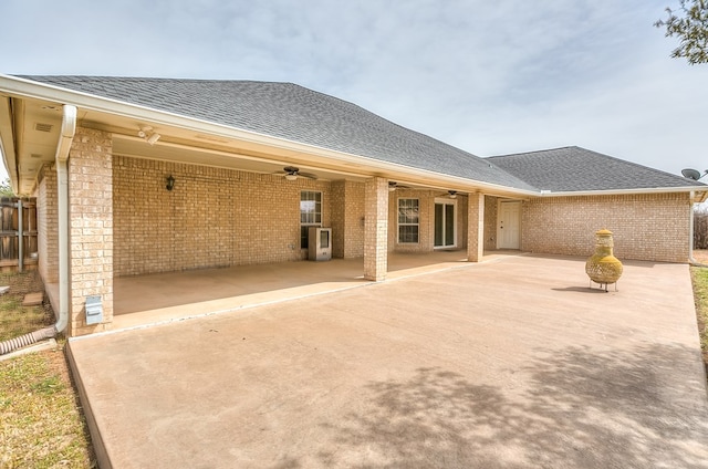 601 Burlington Rd, San Angelo, TX 76901 - rear view of property featuring ceiling fan, a shingled roof, a patio, and brick siding
