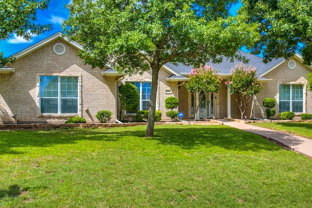 601 Burlington Rd, San Angelo, TX 76901 - view of front of home with brick siding and a front yard