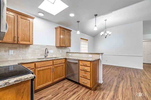 4129 Sedona Trl, San Angelo, TX 76904 - kitchen featuring stainless steel dishwasher, a peninsula, vaulted ceiling, a sink, and electric stove