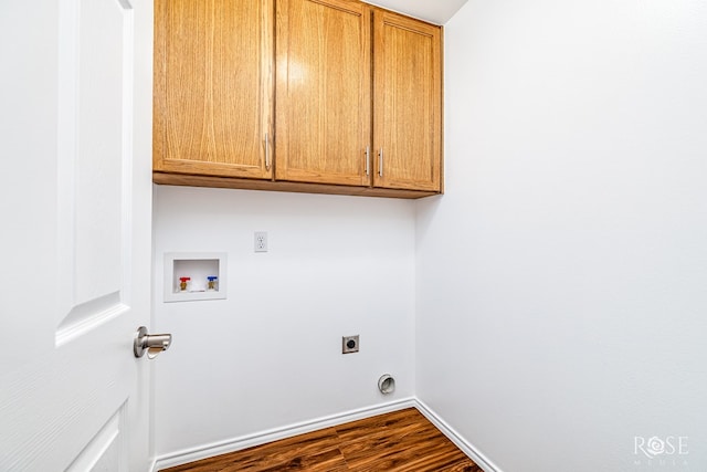 4129 Sedona Trl, San Angelo, TX 76904 - laundry room featuring washer hookup, electric dryer hookup, cabinet space, baseboards, and dark wood finished floors