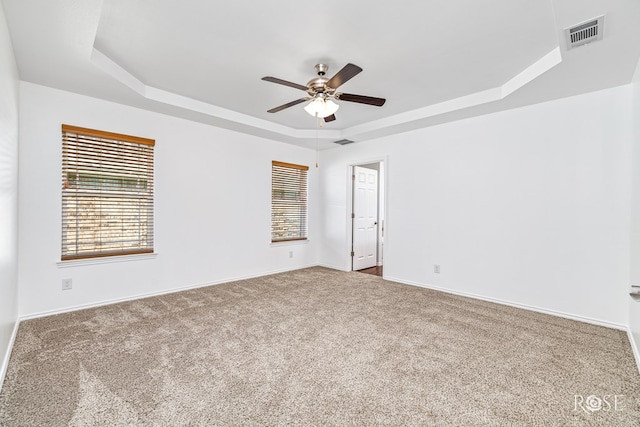 4129 Sedona Trl, San Angelo, TX 76904 - carpeted empty room with a raised ceiling, a ceiling fan, and baseboards