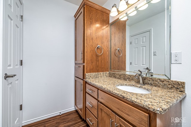 4129 Sedona Trl, San Angelo, TX 76904 - bathroom with vanity, wood finished floors, and baseboards