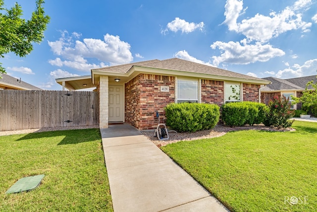 4129 Sedona Trl, San Angelo, TX 76904 - view of front of home featuring brick siding and roof with shingles