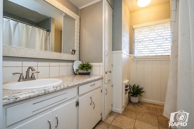 bathroom featuring vanity, tasteful backsplash, and tile patterned floors