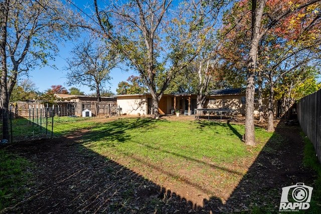 view of yard with a trampoline