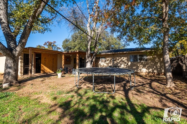 view of yard featuring a trampoline