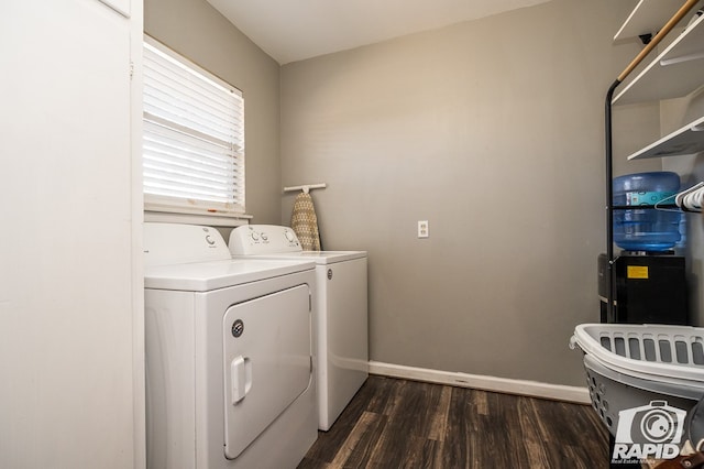 clothes washing area featuring dark hardwood / wood-style flooring and washing machine and dryer