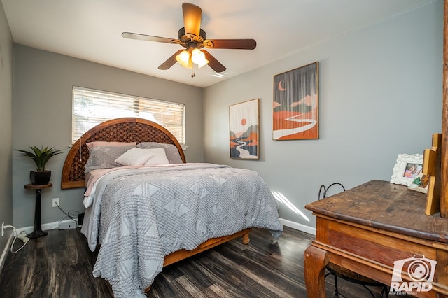 bedroom with dark hardwood / wood-style floors and ceiling fan