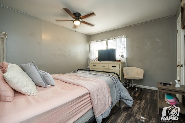 bedroom featuring ceiling fan and dark hardwood / wood-style floors