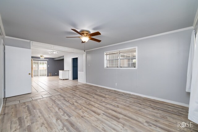 3109 College Hills Cir, San Angelo, TX 76904 - unfurnished living room with a ceiling fan, ornamental molding, light wood-type flooring, and baseboards