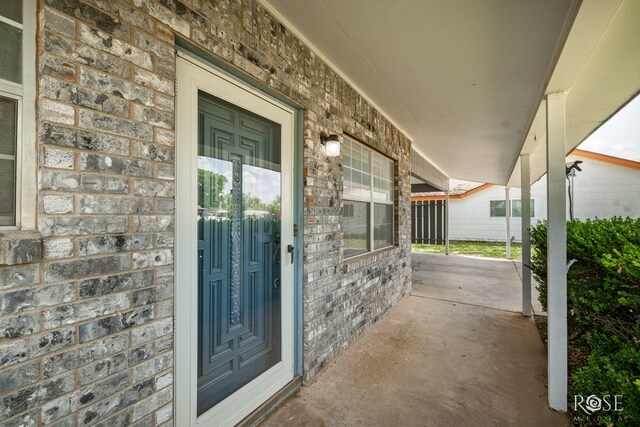 3109 College Hills Cir, San Angelo, TX 76904 - entrance to property with a porch and brick siding