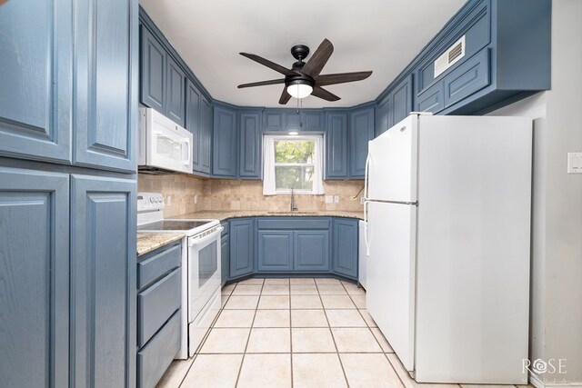 3109 College Hills Cir, San Angelo, TX 76904 - kitchen with white appliances, a sink, blue cabinets, and decorative backsplash