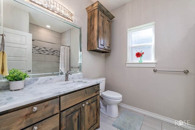 bathroom with vanity, curtained shower, tile patterned floors, and toilet