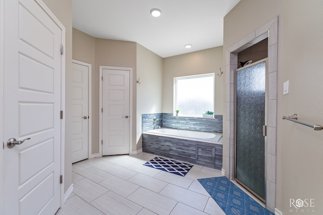 bathroom featuring tile patterned floors and plus walk in shower