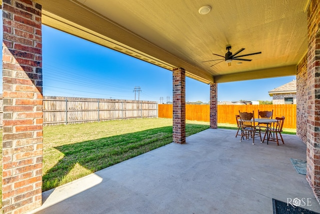 view of patio featuring ceiling fan