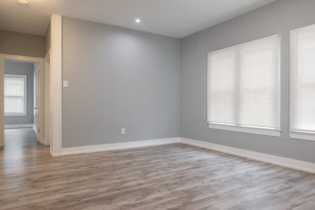 1905 Live Oak St, San Angelo, TX 76901 - spare room with wood finished floors, baseboards, and recessed lighting