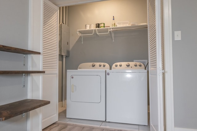 1905 Live Oak St, San Angelo, TX 76901 - laundry room featuring washing machine and clothes dryer, laundry area, and electric panel