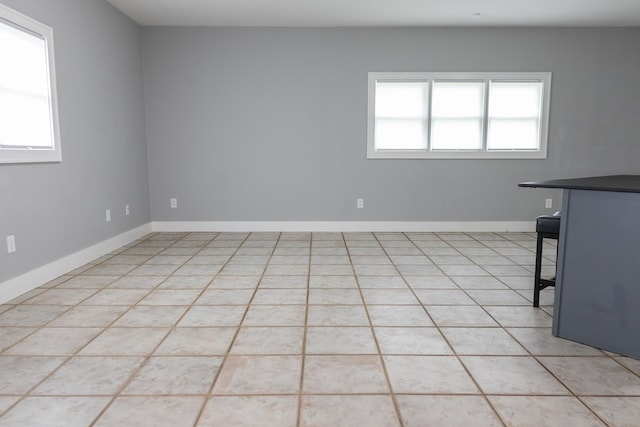 1905 Live Oak St, San Angelo, TX 76901 - empty room featuring baseboards and a healthy amount of sunlight
