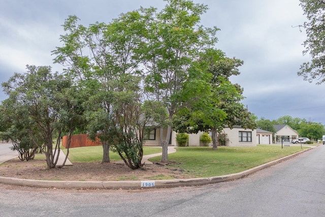 1905 Live Oak St, San Angelo, TX 76901 - view of front of property featuring a front yard, fence, and a garage