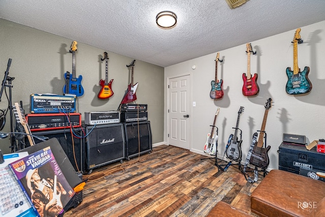 705 Fay St, Sonora, TX 76950 - misc room featuring wood finished floors and a textured ceiling