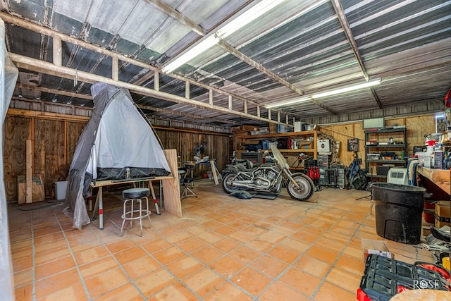 705 Fay St, Sonora, TX 76950 - garage featuring wood walls