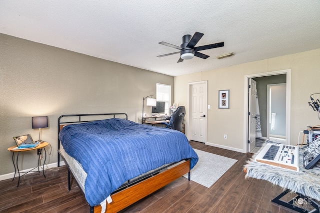 705 Fay St, Sonora, TX 76950 - bedroom featuring wood finished floors, a textured ceiling, a ceiling fan, and a desk
