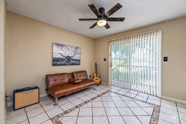 705 Fay St, Sonora, TX 76950 - sitting room featuring a ceiling fan, light tile patterned flooring, and a textured ceiling