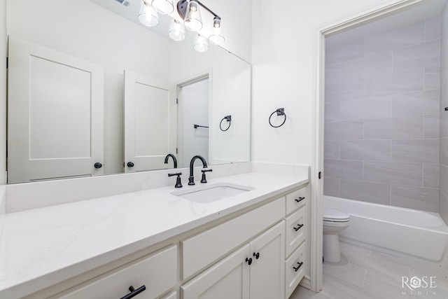 bathroom featuring toilet, shower / tub combination, and vanity