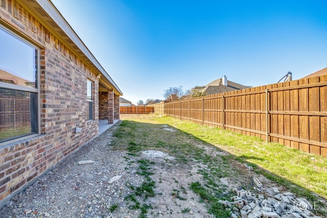 view of yard featuring a fenced backyard