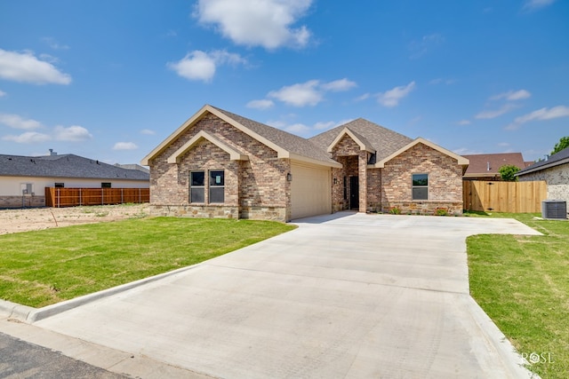 5441 Riviera Ln, San Angelo, TX 76904 - ranch-style home featuring driveway, fence, brick siding, and a garage