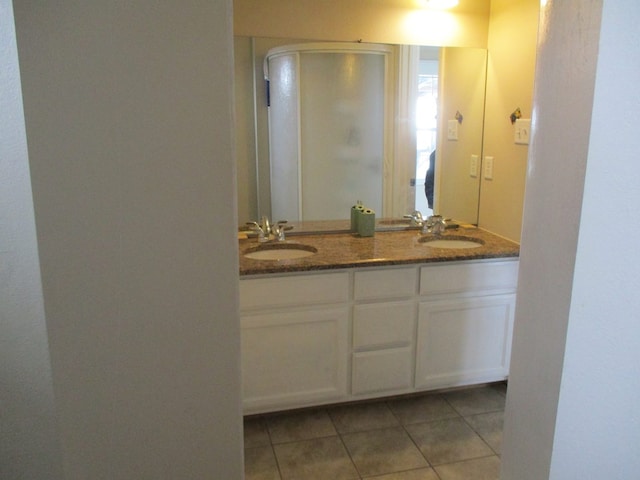 bathroom featuring vanity and tile patterned flooring