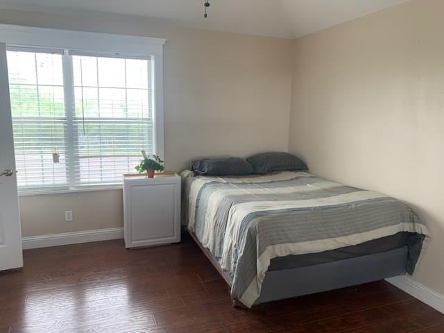 bedroom featuring dark hardwood / wood-style flooring