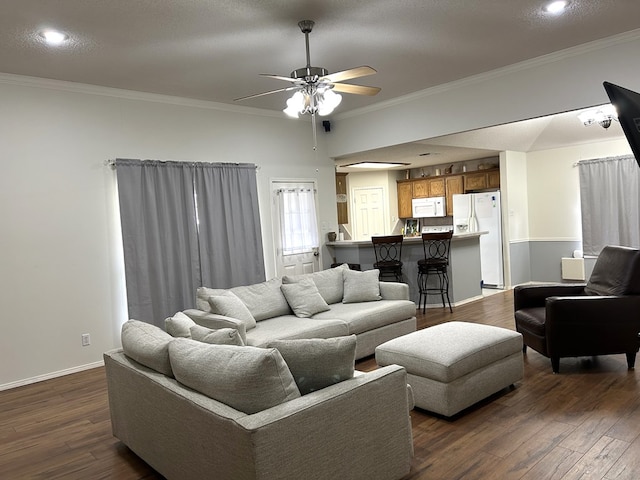 3570 Grandview Dr, San Angelo, TX 76904 - living room featuring dark wood-type flooring, a ceiling fan, ornamental molding, and recessed lighting