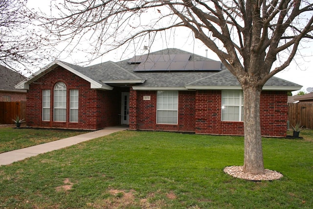 3570 Grandview Dr, San Angelo, TX 76904 - single story home with a shingled roof, roof mounted solar panels, and brick siding