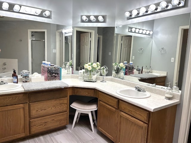 3570 Grandview Dr, San Angelo, TX 76904 - full bathroom featuring double vanity, a stall shower, and a bath