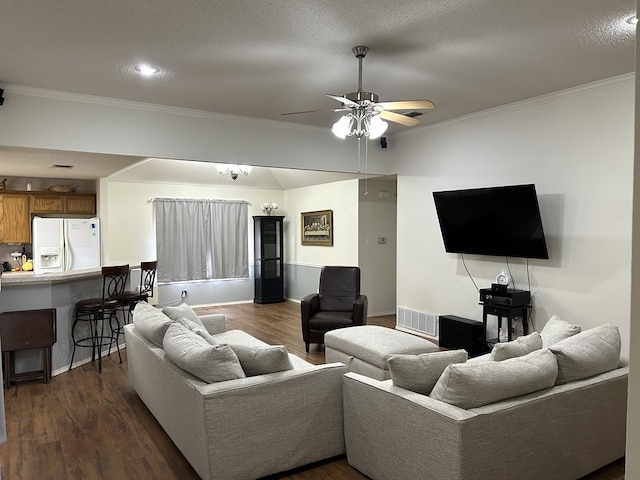3570 Grandview Dr, San Angelo, TX 76904 - living area featuring dark wood-type flooring, ceiling fan, and ornamental molding