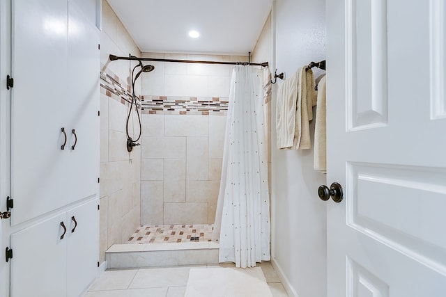 6290 Stokes Rd, San Angelo, TX 76904 - bathroom with a stall shower, tile patterned flooring, recessed lighting, and baseboards