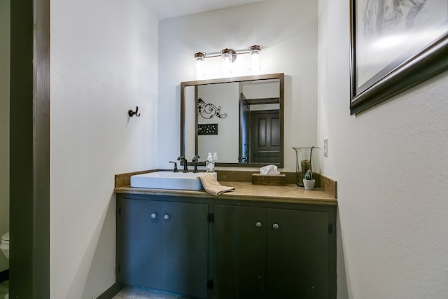 6290 Stokes Rd, San Angelo, TX 76904 - bathroom with vanity and toilet