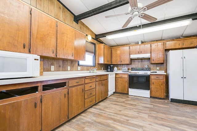 6290 Stokes Rd, San Angelo, TX 76904 - kitchen with white appliances, under cabinet range hood, light wood-style floors, brown cabinetry, and beamed ceiling
