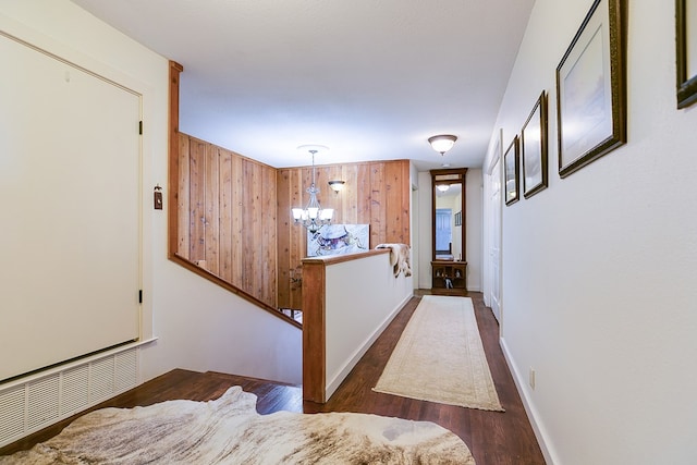 6290 Stokes Rd, San Angelo, TX 76904 - hallway featuring a chandelier and wood finished floors