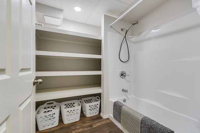 6290 Stokes Rd, San Angelo, TX 76904 - bathroom featuring wood finished floors and shower / bathtub combination