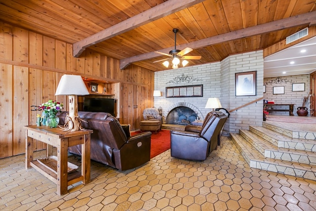6290 Stokes Rd, San Angelo, TX 76904 - living room with a brick fireplace, beam ceiling, brick wall, wood ceiling, and a ceiling fan